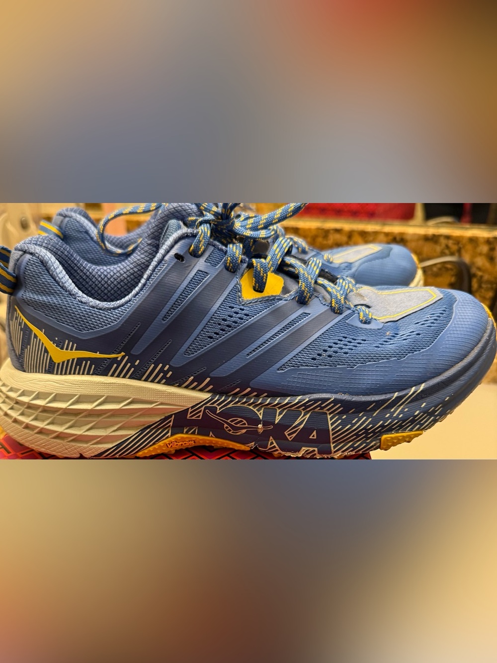 Hoka Blue Trail Running Shoes with Yellow Accents